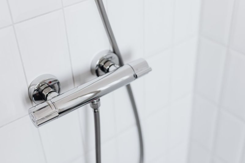 Calgary plumber fitting a bathroom sink fixture and checking plumbing connections